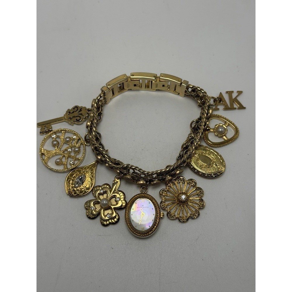 Anne Klein 10/8096 New Battery Ladies Gold Tone Charm MOP Watch 17MM 7"